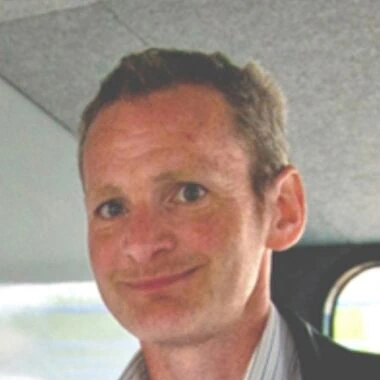 Portrait photo of Julian Sutton.