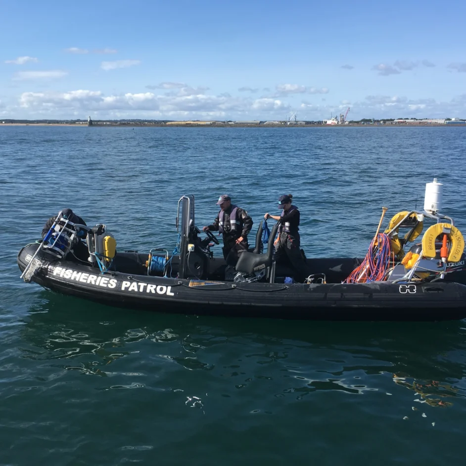 Fisheries patrol boat with two NIFCA officers on board.