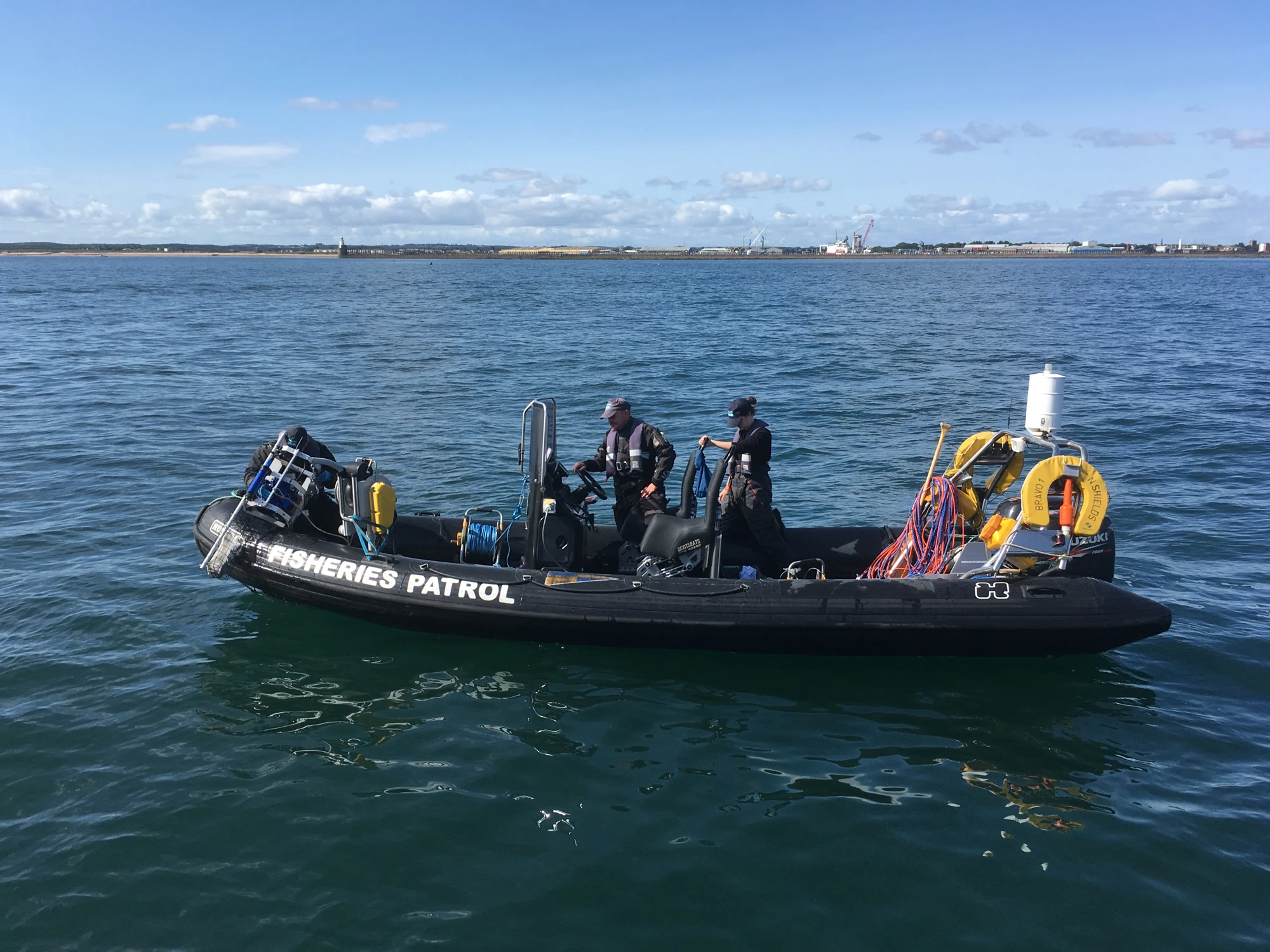 Fisheries patrol boat with two NIFCA officers on board.